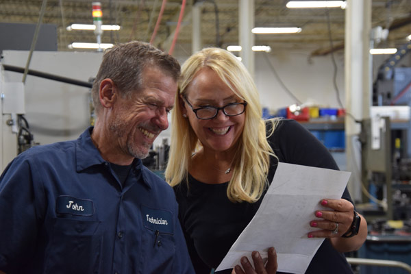 John and Kristen reviewing blueprints